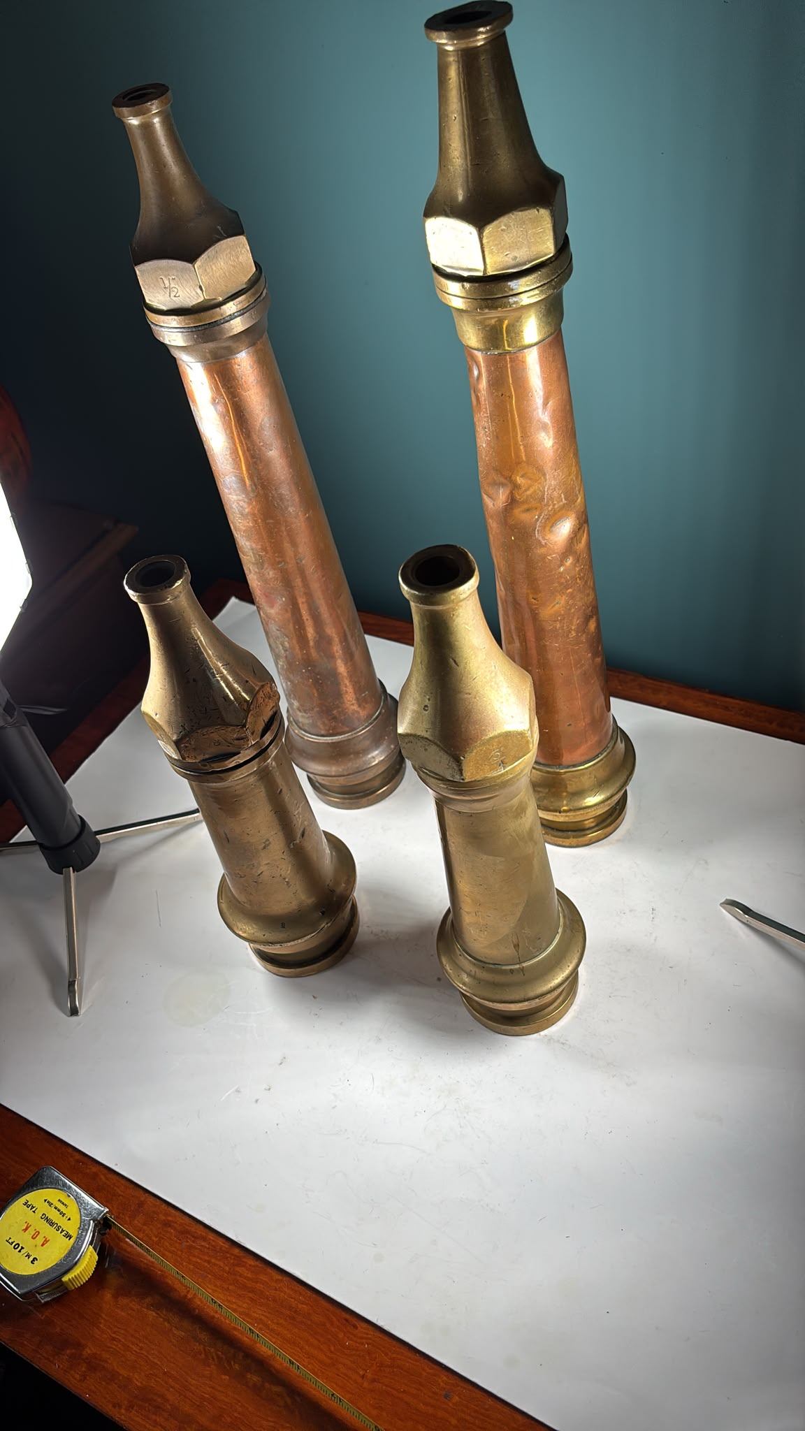 Image of 4 vintage copper and brass fire hose nozzles