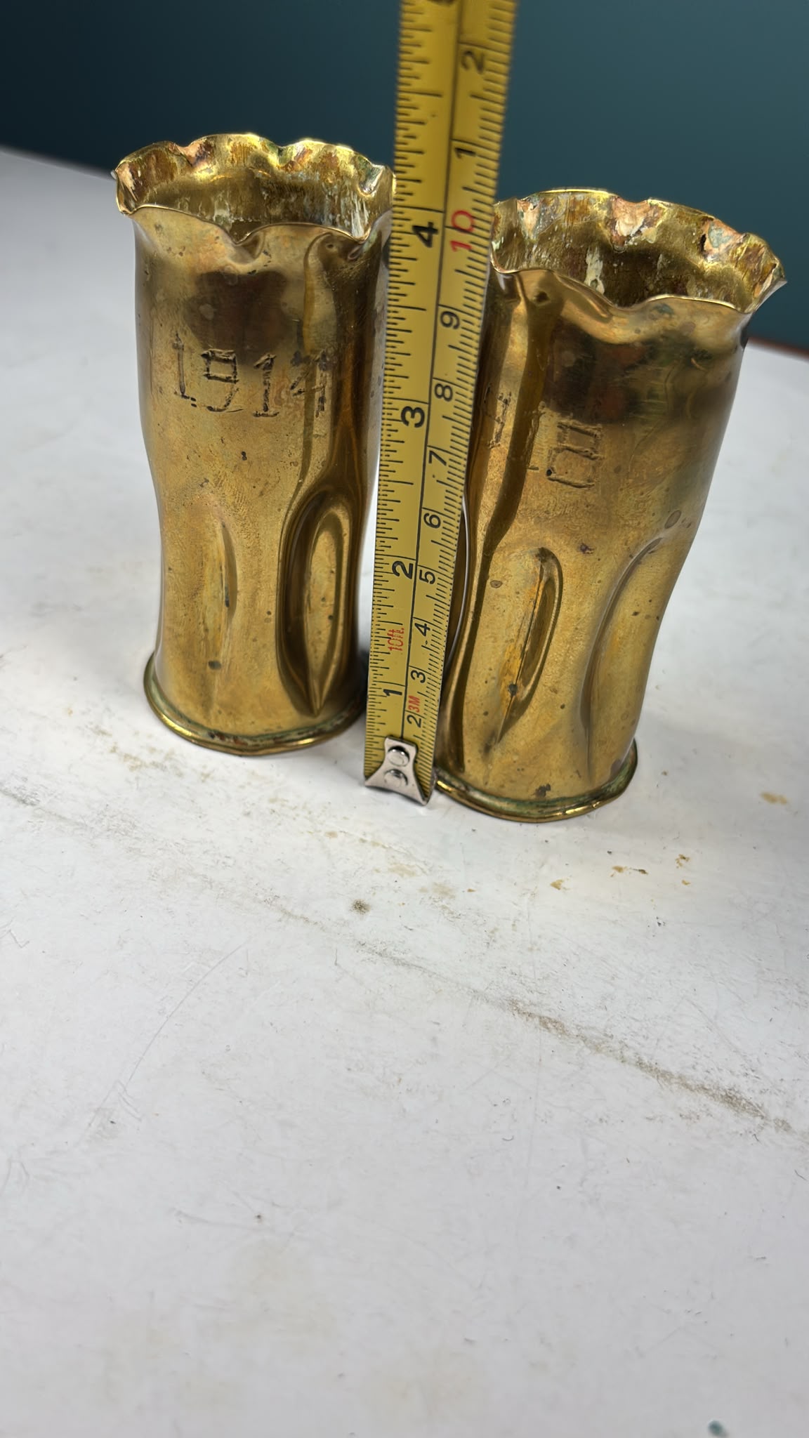 Image of A pair of brass bullet casings from WW1 dated 1914 and 1918
