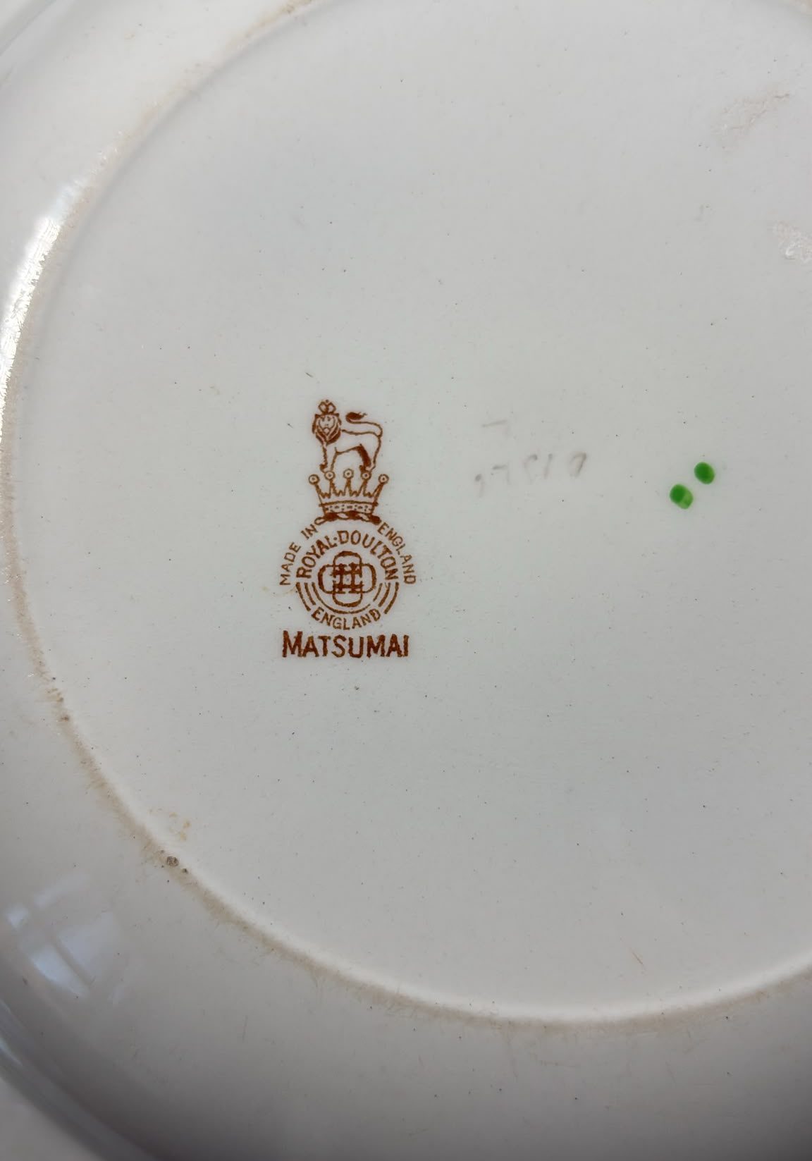 An image of The base of one of A pair of Royal Doulton “Matsumai” soup plates from the 19 th century