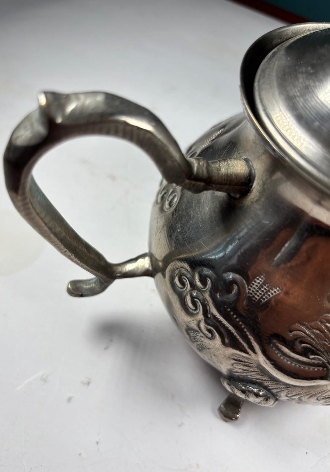 Image of Vintage, silver plated, embossed teapot and lid