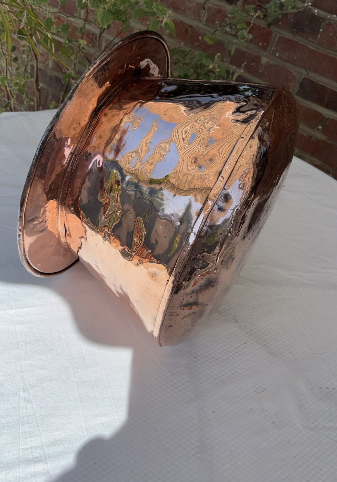 Image of copper planter with silver finish to top edge