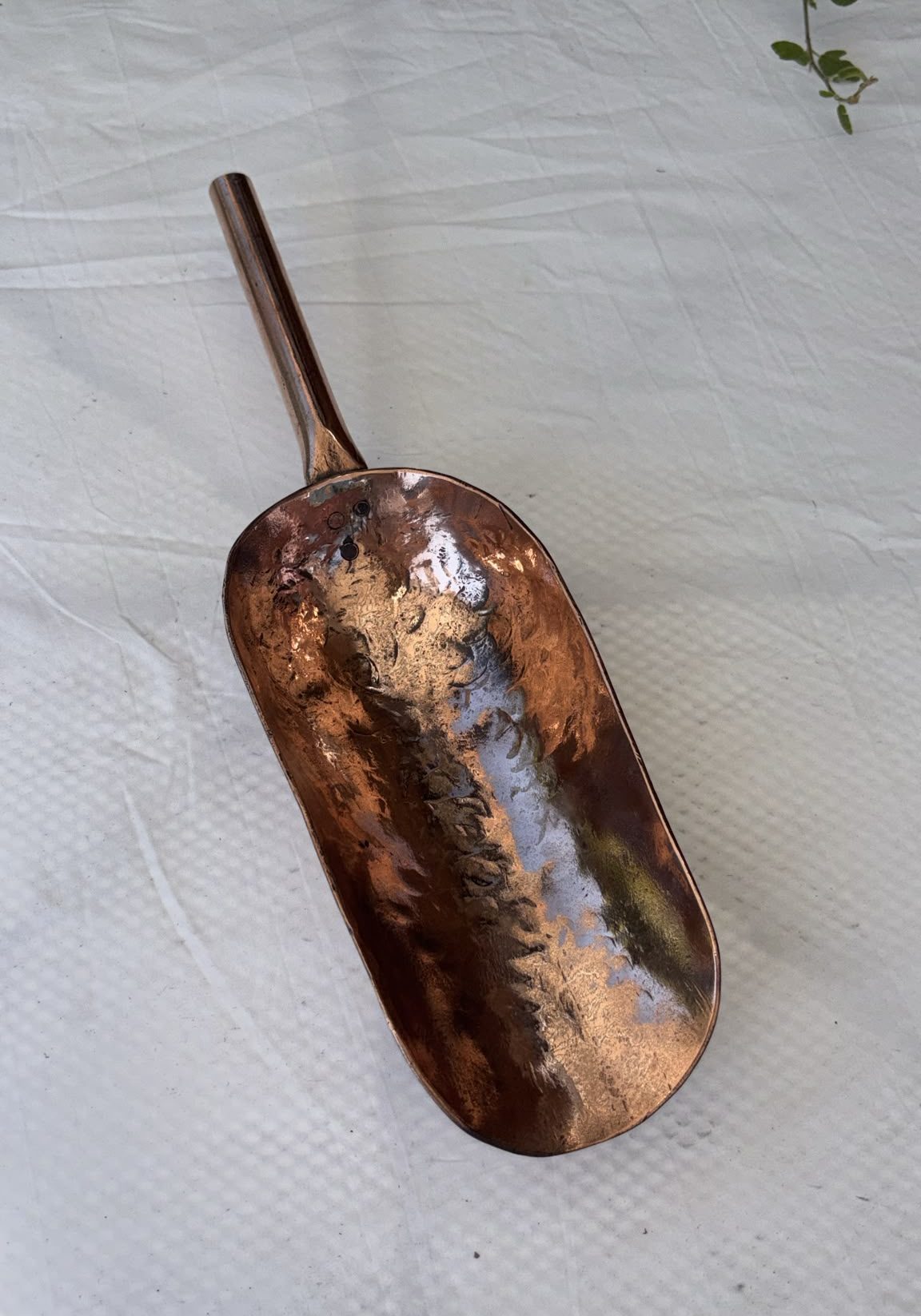 Image of solid copper scoop from the Victorian era