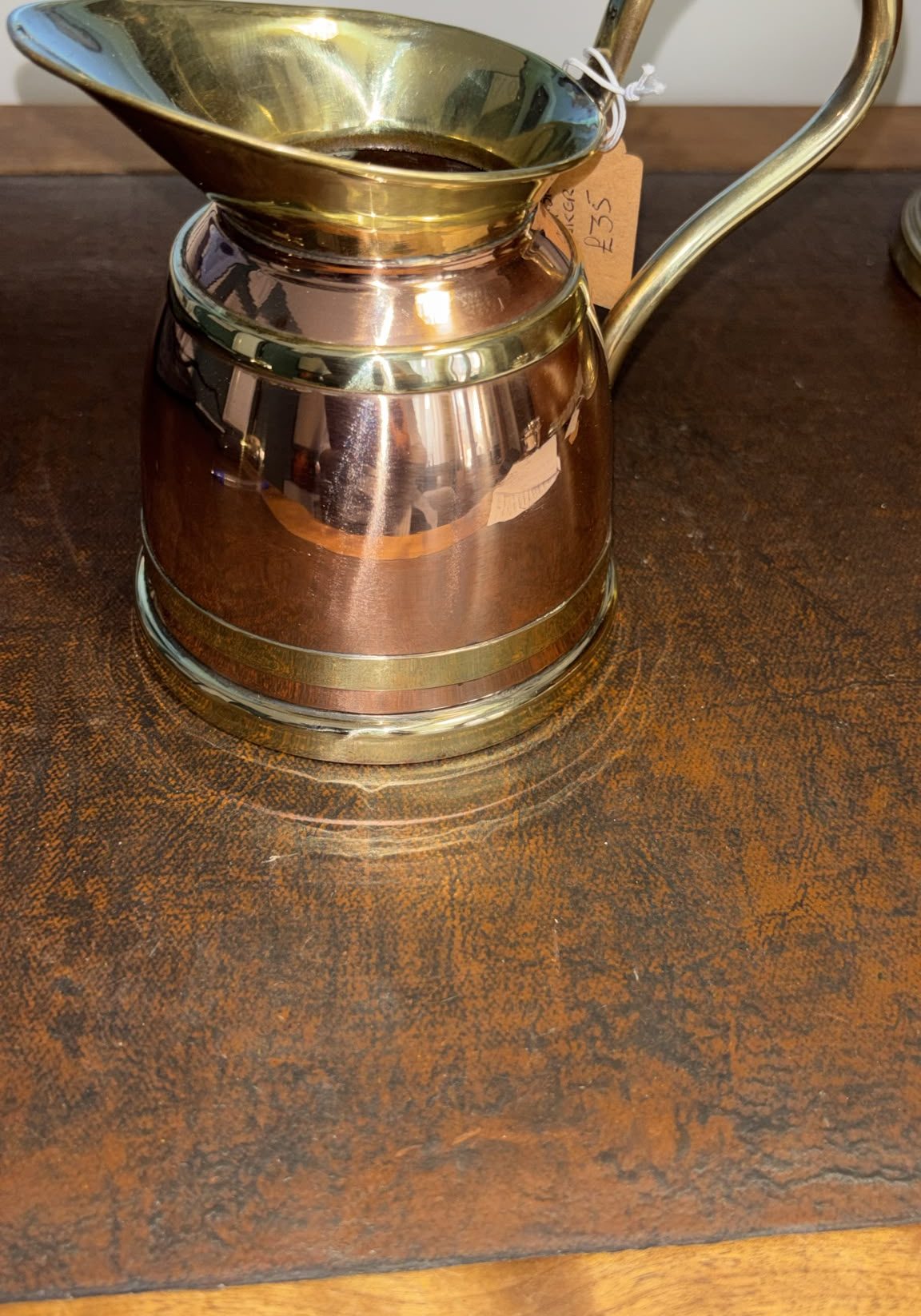 Image of small tankard fashioned from copper and brass