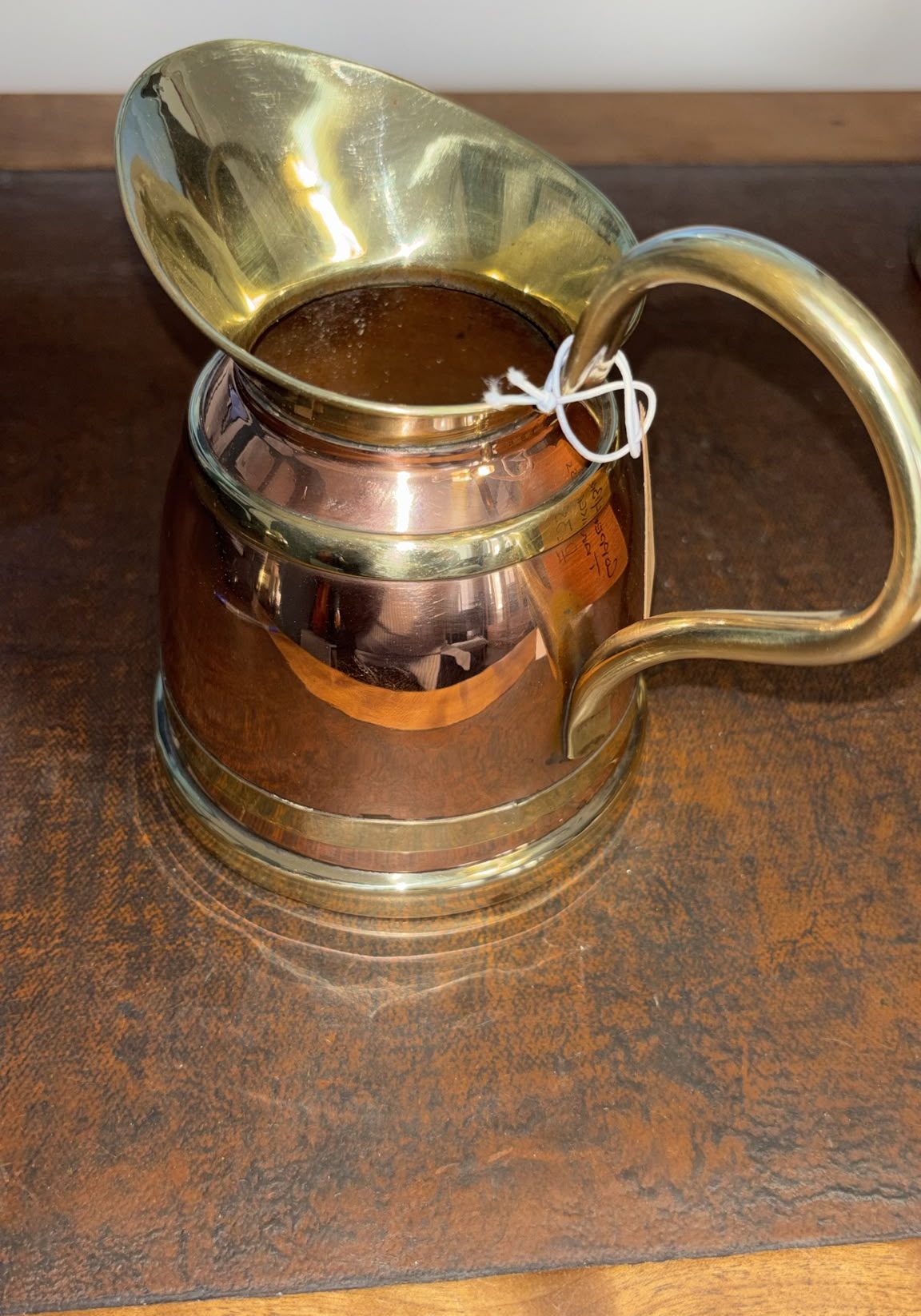Image of small tankard fashioned from copper and brass