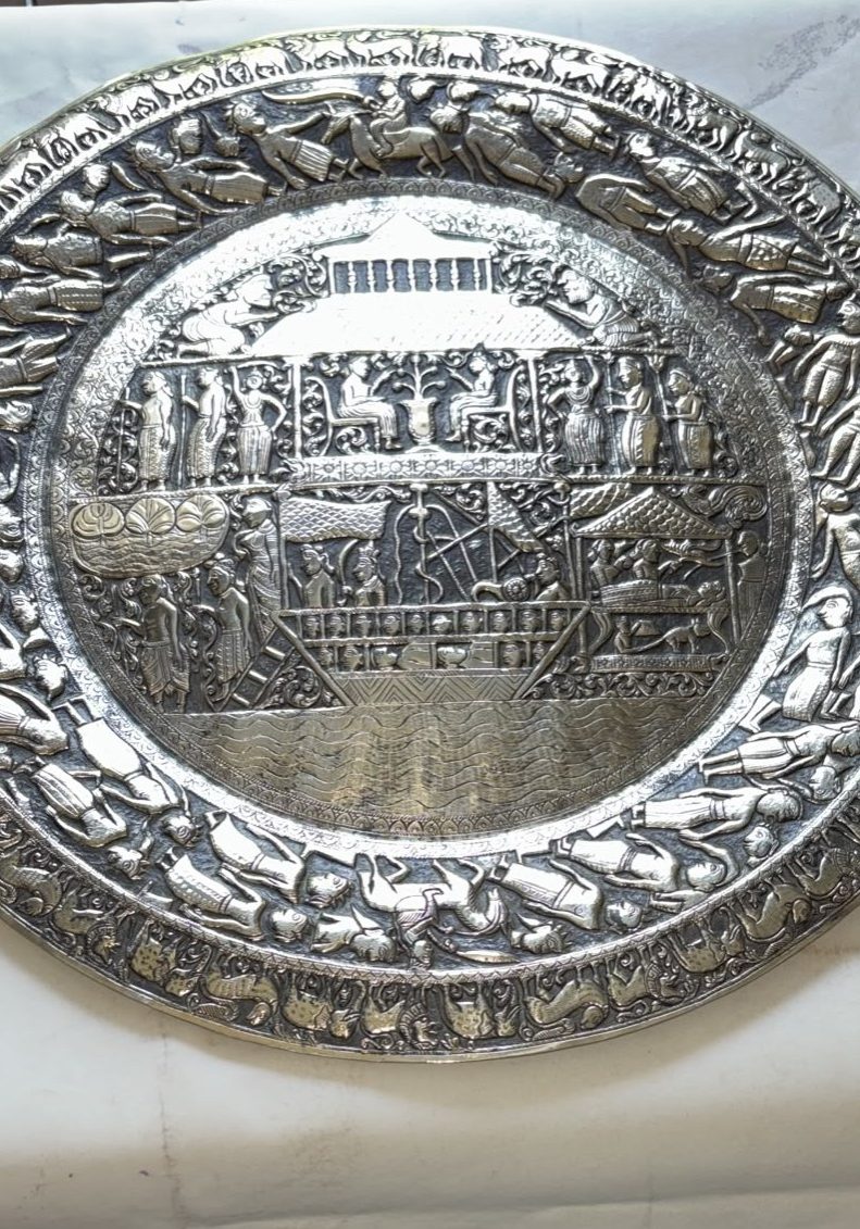 Image of solid brass wall plate made in Persia around 1945. It depicts Noah’s Ark